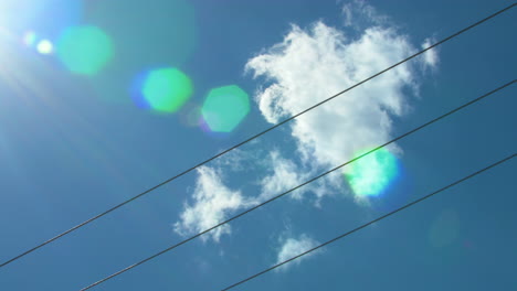 cloud drifts across power lines