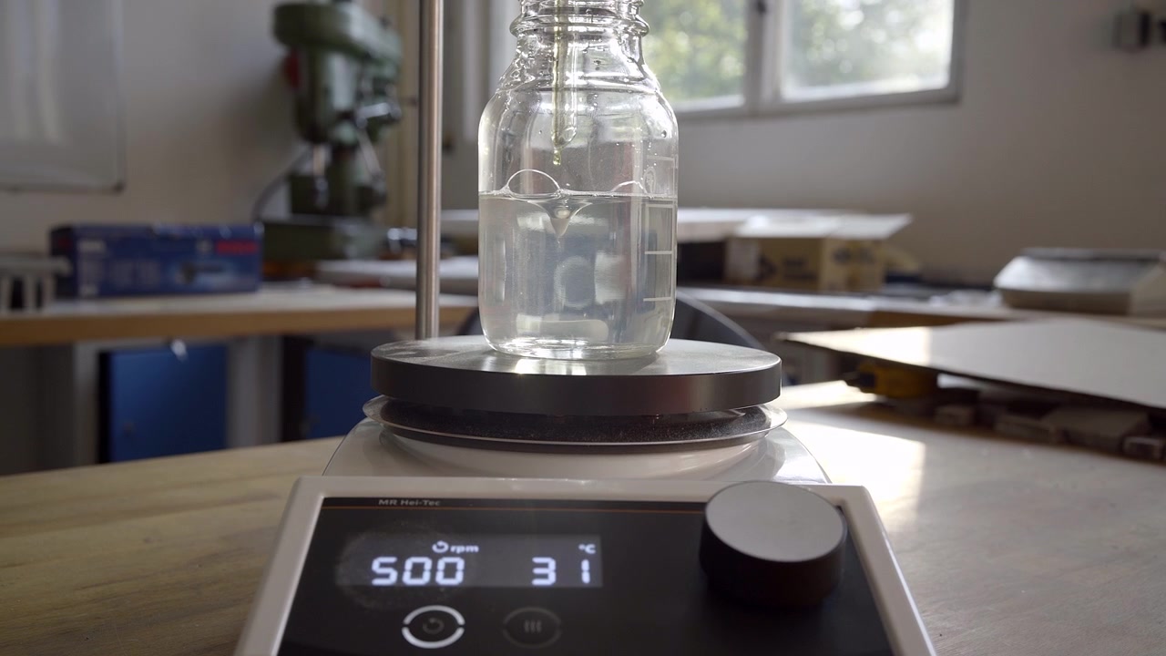 Solution stirring in laboratory beaker with magnetic stirrer, 4K