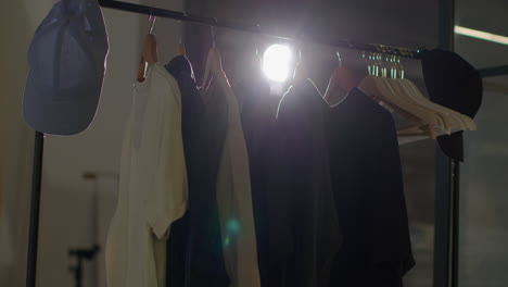 Close-Up-Of-Wardrobe-Clothing-Hanging-On-Rail-During-Movie-Or-Video-Shoot-In-Film-Studio