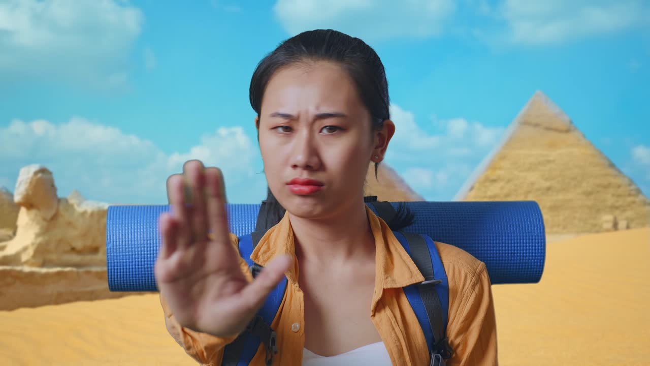 Woman Disapproving Gesture in front of Egyptian Pyramids