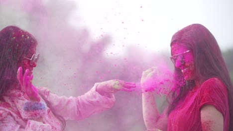 girls playing indian festival holi celebration slowmotion