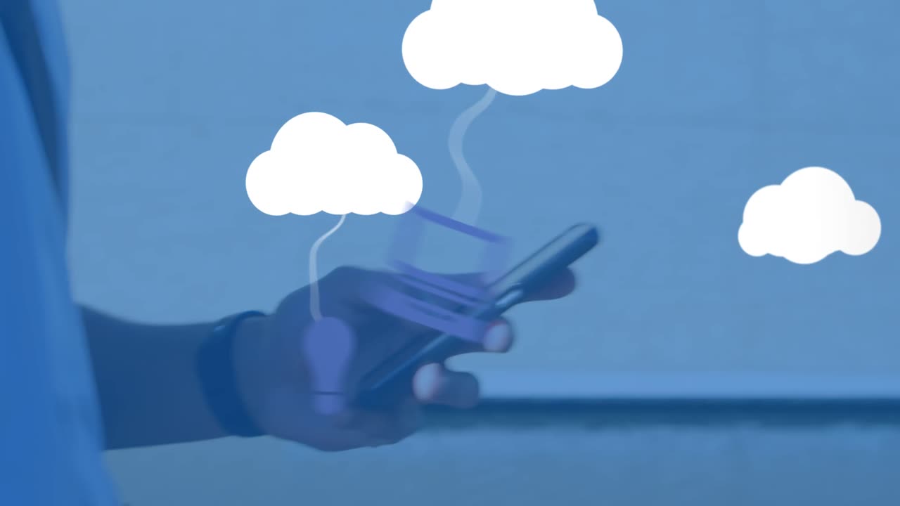 Animation of clouds with electronic devices over caucasian man using smartphone