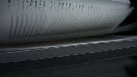 Closeup-turning-pages-of-book.-Detailed-view-leafing-book-sheets