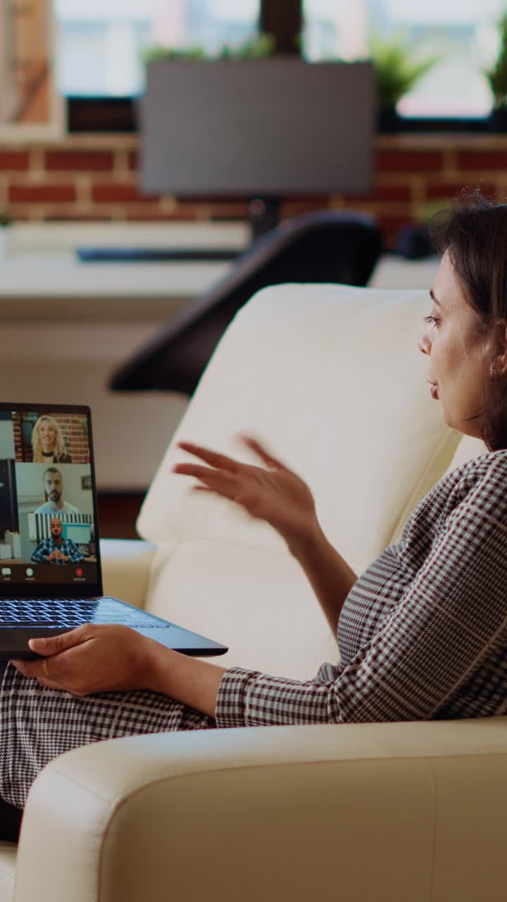 Vertical video Remote worker talks with board of directors during videocall business meeting