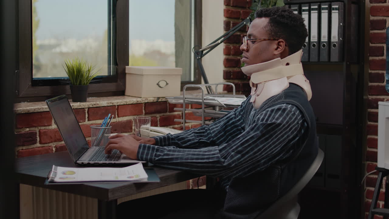 Company employee with neck collar working on business growth