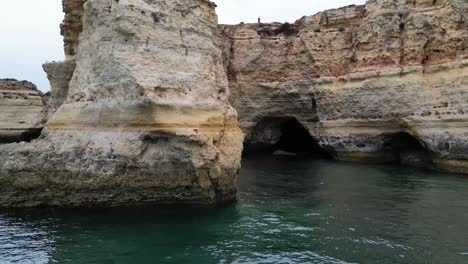 drone shot of cliffs on the algarve coast in portugal