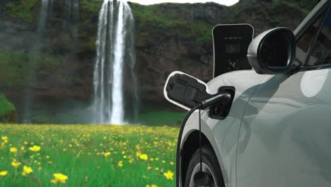 progressive concept of energy sustainability by ev car in the waterfall.