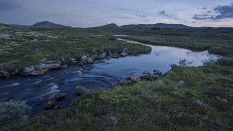 Time-lapse-video-of-calm-mountain-river-at-sunset