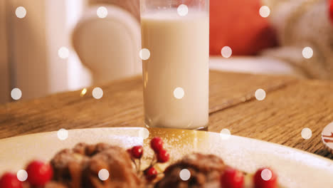 animación de manchas blancas sobre leche y galletas en navidad