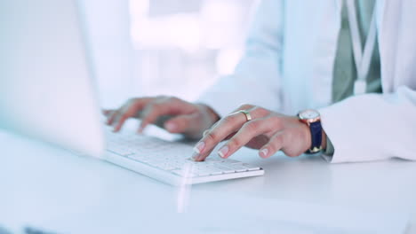 woman, doctor and typing on computer