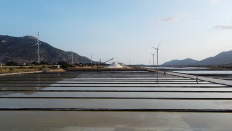 slow and low aerial flying over salt fields, vietnam