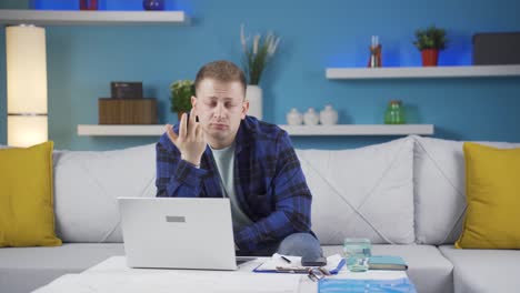 home office worker man thinking looking at camera.