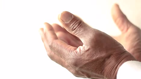 man-praying-to-god-with-hands-together-on-white-background-with-people-stock-video-stock-photo