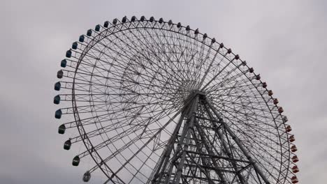 time-lapse of a ferris wheel rotating against the sky