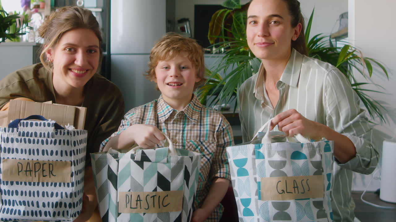 Portrait of Happy LGBT Family with Sorted Waste at Home