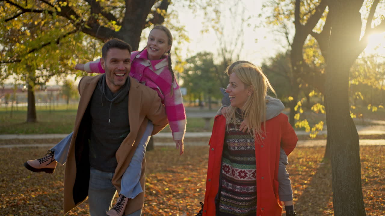 Family having fun outdoors in autumn