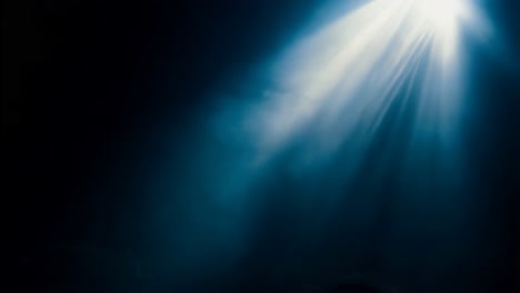 spotlight beam in dark room