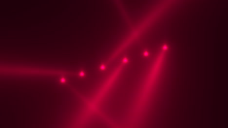 red glowing spotlight beams on black gradient stage