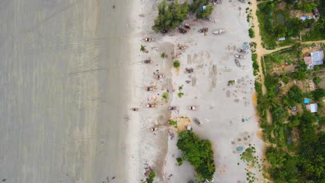 Fishing-Boats-Rest-on-the-Sandy-Shores-of-the-Beaches-Along-the-Coast-of-Bangladesh---Aerial-Overhead-Shot