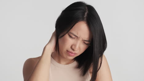 asian woman feeling tired on camera.