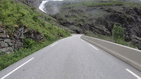 pov of car driving on trollstigen mountain road in norway - timelapse