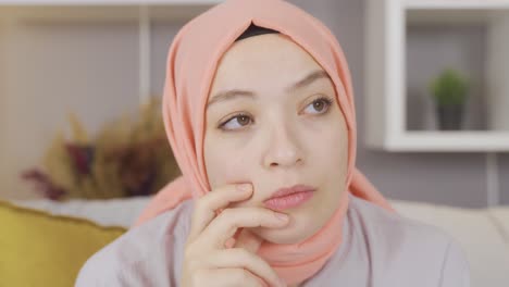 muslim woman in hijab is thoughtful and hopeless.