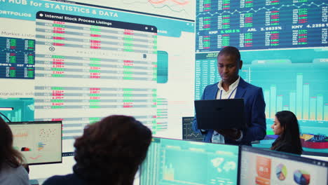 chief financial officer studying capital funds and revenue data on big screen