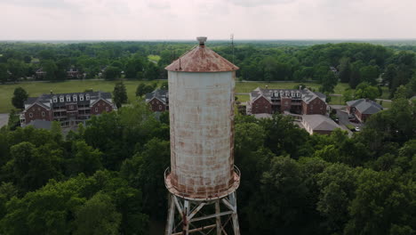 close up aerial shot of old water tower high structure in lawrence, indiana