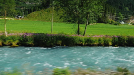 view of the beautiful rural landscape in scandinavia filmed from a car window 4k video