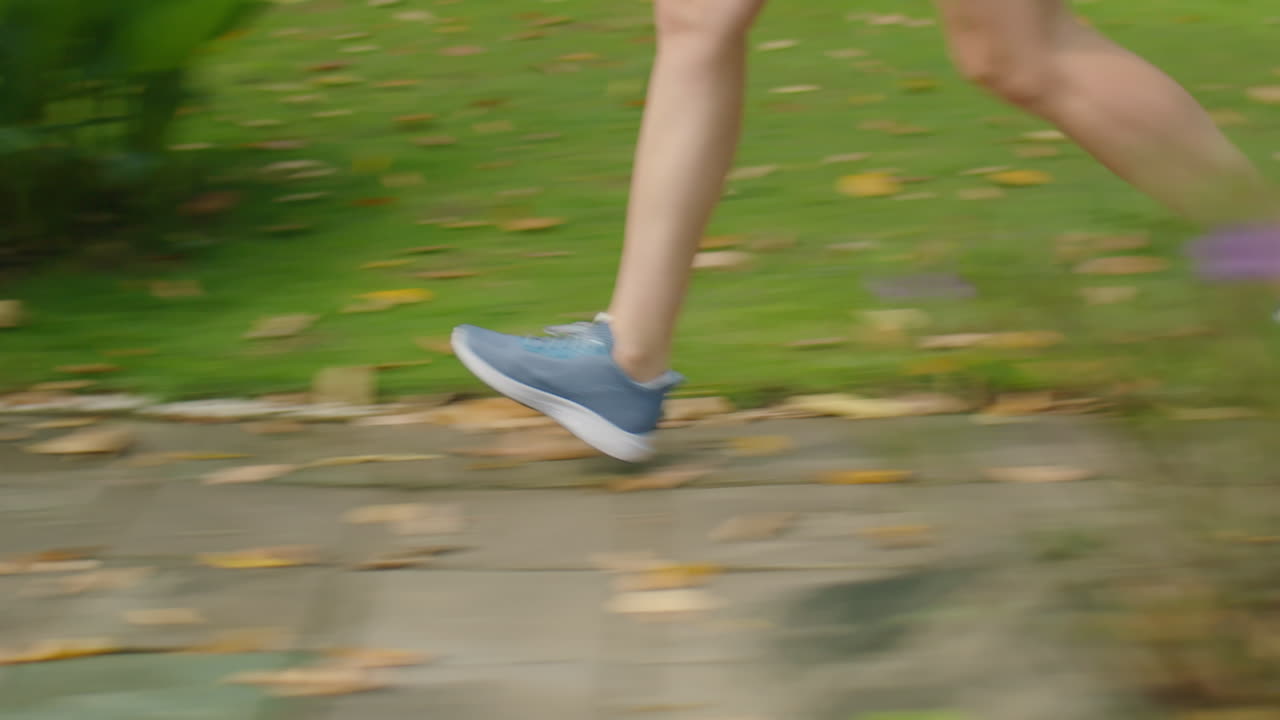 Sportive Girl Jogging Outdoors in Morning