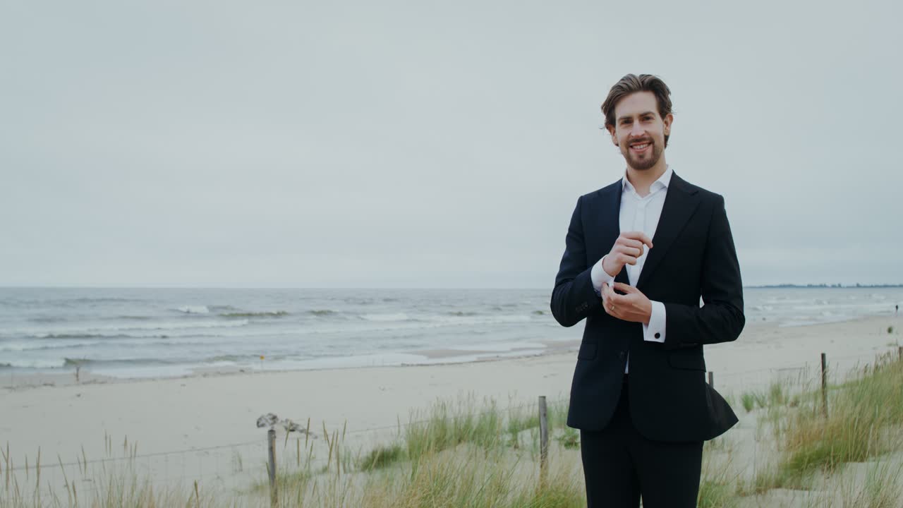 Man in suit on the beach