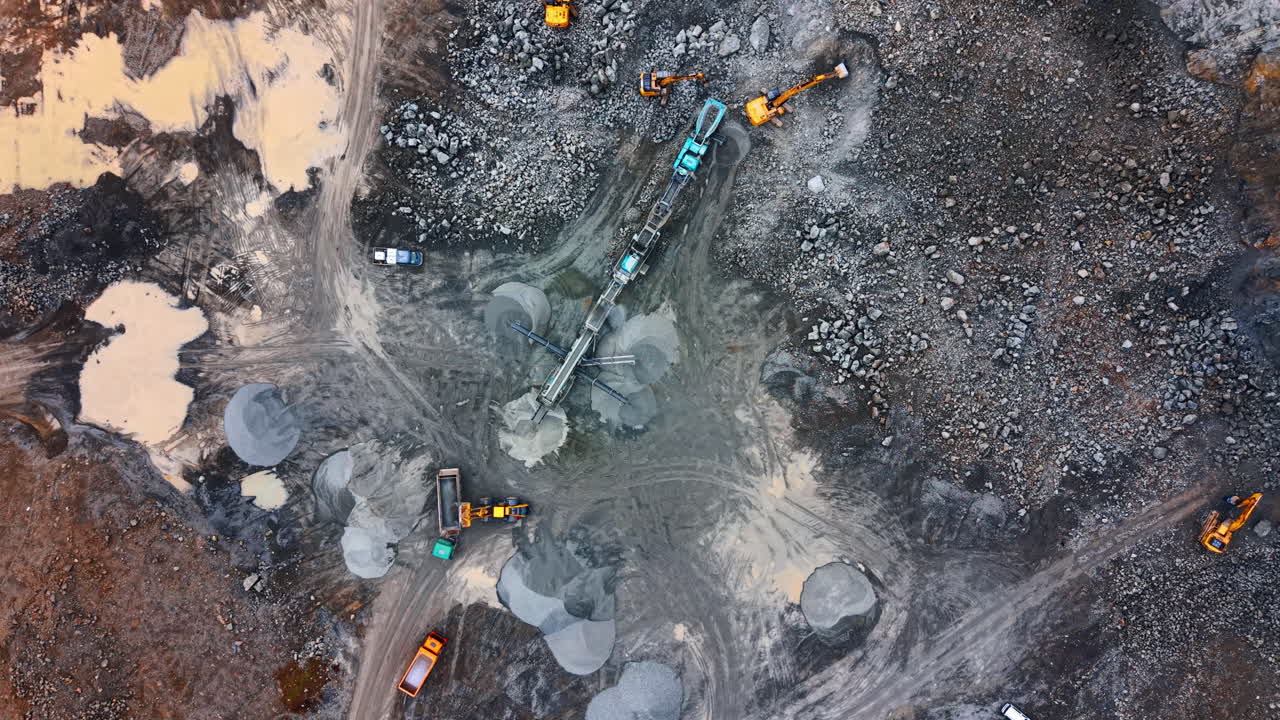 Machinery at work on-site. Heavy machinery operates on a construction site. Trucks and equipment work together to move materials and reshape land