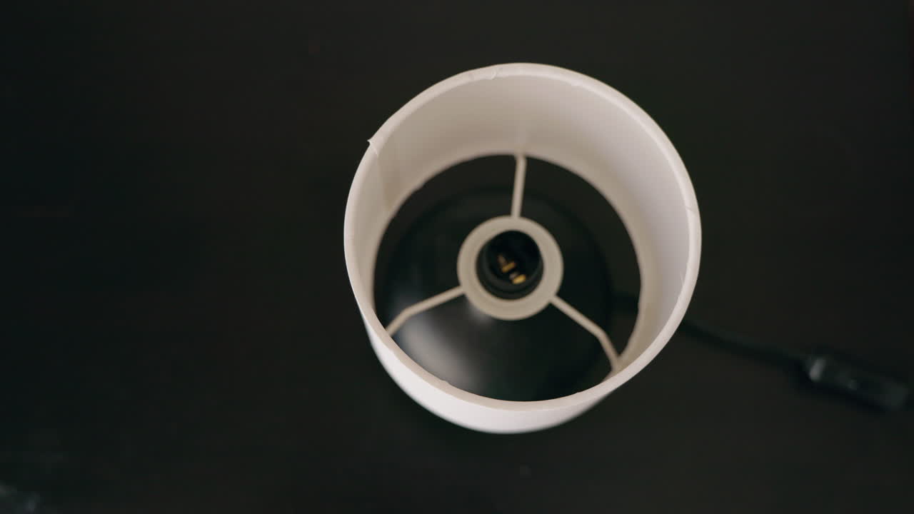 Installing a light bulb in a lamp