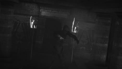 Animation-of-scary-zombie-mummy-walking-in-dark-crypt-with-burning-torches,-in-black-and-white