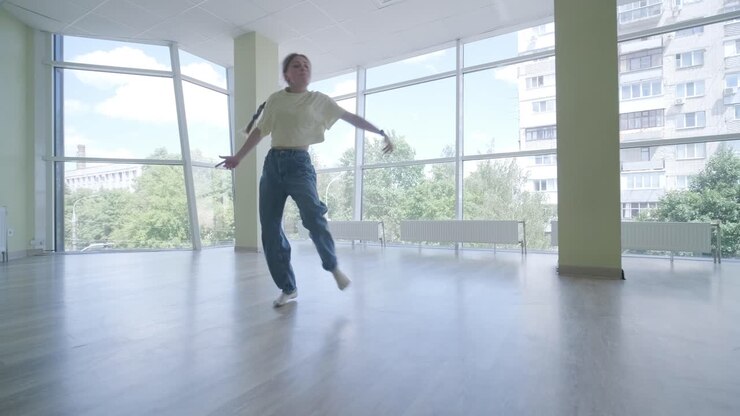 Young Girl Breakdancing in Modern Studio
