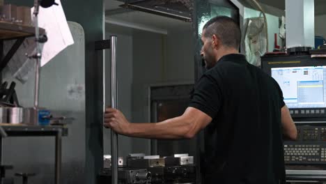 man operating cnc machine