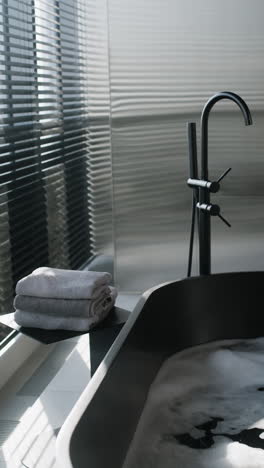 modern black bathtub in a luxurious bathroom