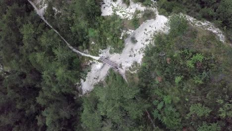 Aerial-top-view-of-Sugana-Valley,-with-drone-rotating-while-descending