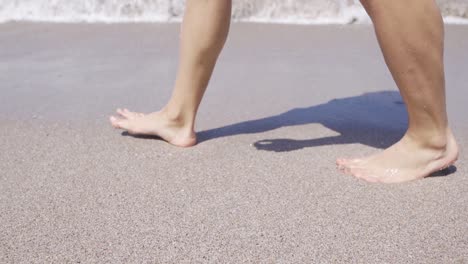 running on the beach outdoors in slow motion.