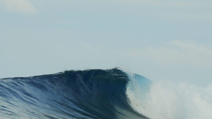 Huge waves barrel crashing Taverna Right Namotu Left Cloudbreak Swimming Pools Wilks Passage glassy surf surfer hallow face of the wave groundswell tourism Fiji Suva Nadi Malalo Island super slow pan