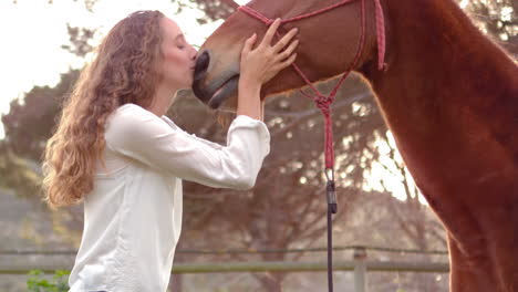 woman kissing horse