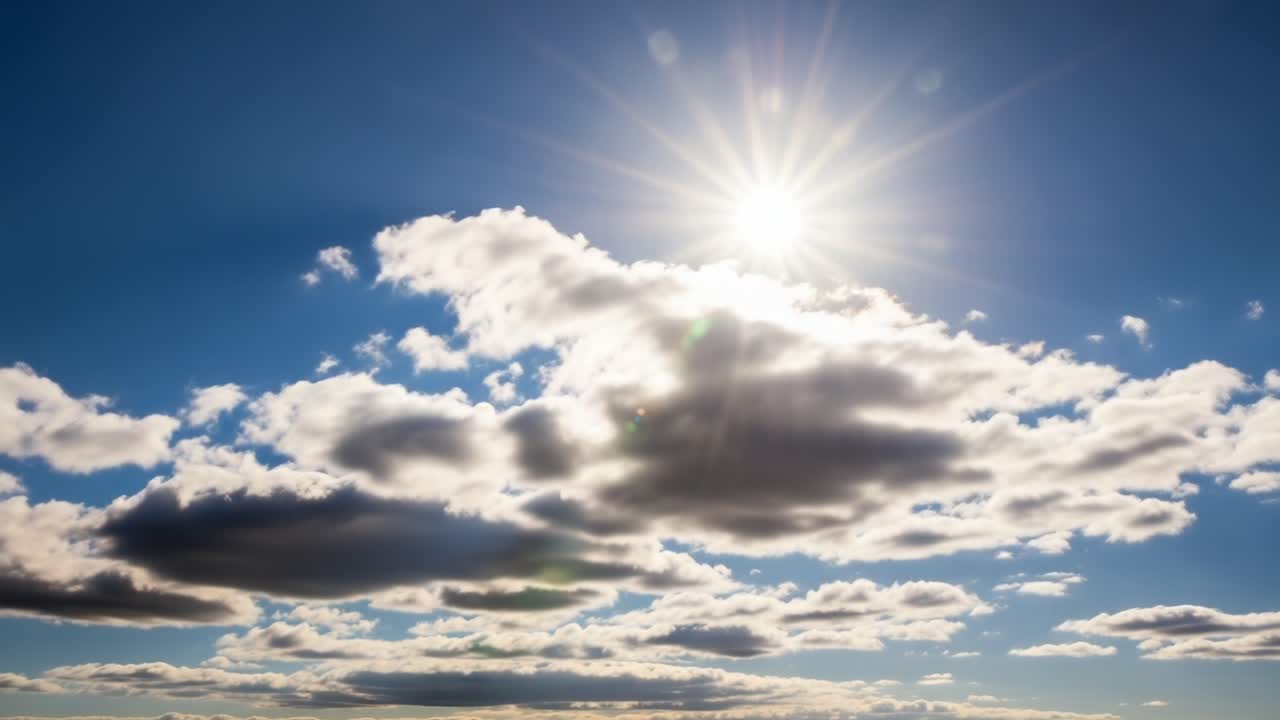 Majestic Cloudscape: A Breathtaking Display of Sunlight Filtering Through Fluffy Clouds in a Clear Sky Captured in Two Stunning Frames