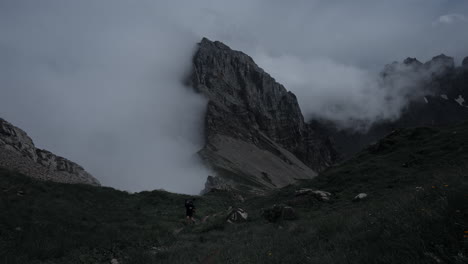 hiker in misty mountain valley