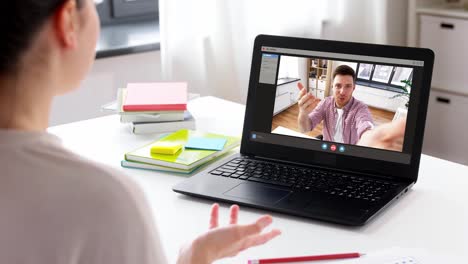 people,-technology-and-online-communication-concept--laptop-with-family-having-video-call-or-virtual-birthday-party-on-screen,-cake,-gift-box-and-coffee-on-table-at-home