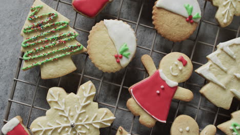 Video-of-christma-cookies-decorated-sugar-icing-with-copy-space-on-grey-background