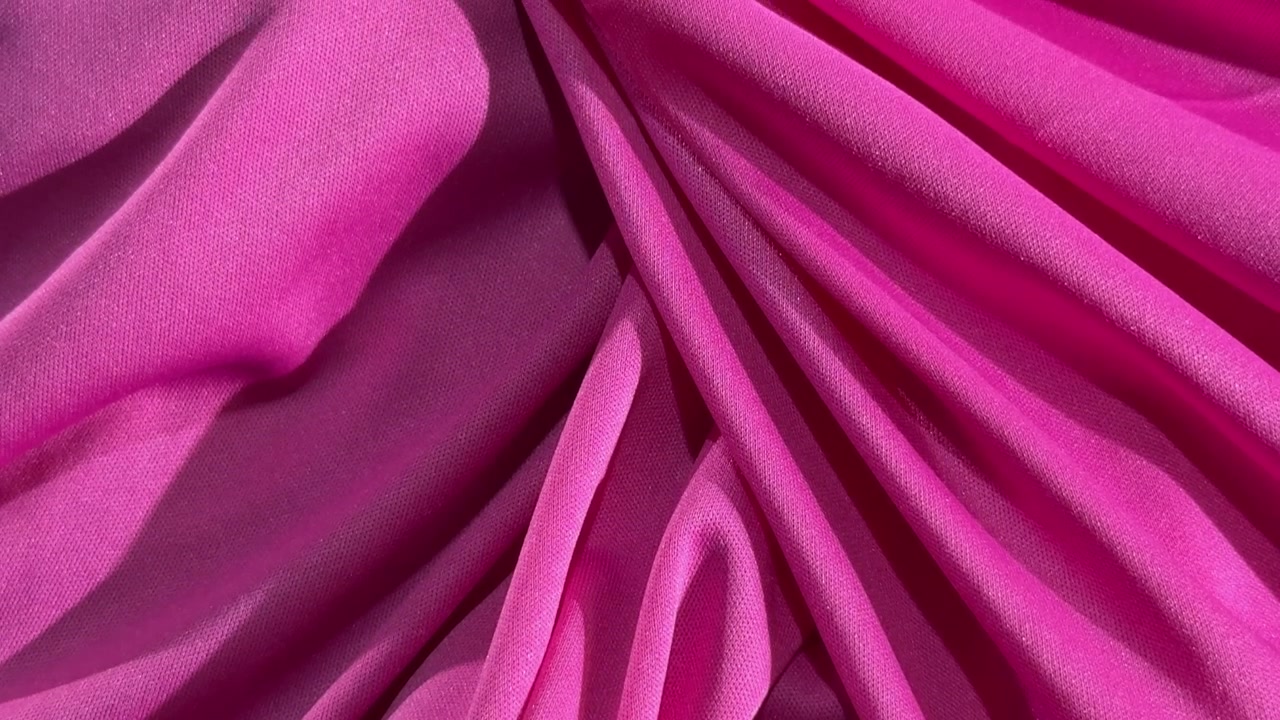 Close-up of Vibrant Pink Fabric with Soft Folds