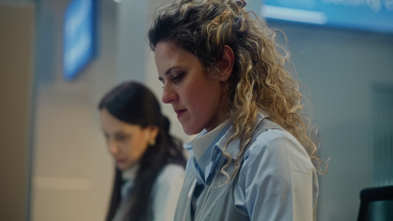 Two Women at a Reception Desk
