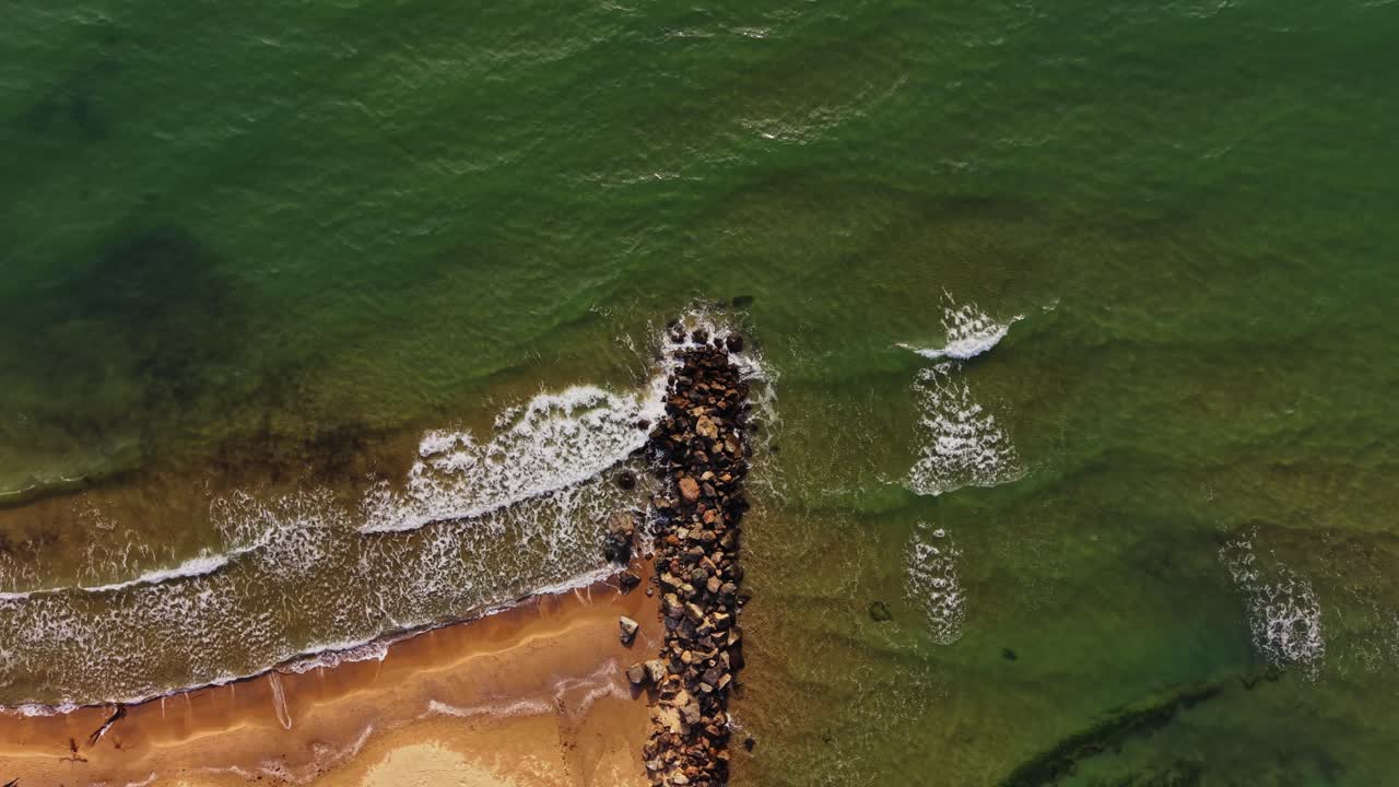 Aerial view of the coastline and rocky jetty in Bulgaria
