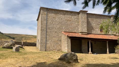 filming of a sanctuary of its front entrance from a recreational area of   the sanctuary garden, being located under a tree, we appreciate its ancient structure with medieval style, 15th century