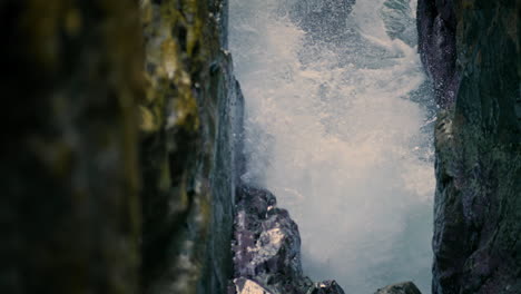 Marine-splashes-rocky-nature-closeup.-Ocean-waves-breaking-at-summer-cliff-place